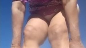 Mature Latina granny with hairy pussy stopping to piss pee in the desert