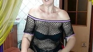 Again, cheerful Lukerya flirts in a black mesh on a washing machine, seducing her with chic hips and sexy legs.
