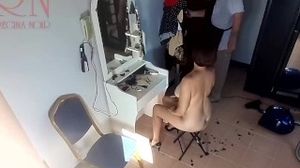 Camera in nude barbershop. Hairdresser makes undress lady ho cut her hair. Barber, nudism. Cam 2 2
